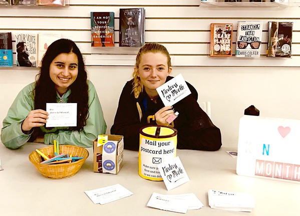 SPREADING KINDNESS SLO High School REACH Club members Malia Cari&ntilde;o (left) and Sabrina Marks (right) hold up "kindness cards," which were individually crafted and distributed to 700 peers, staff, and teachers last March. - PHOTO COURTESY OF ANA O'SULLIVAN