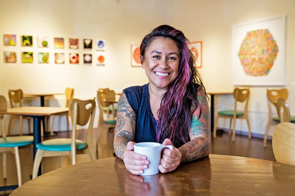 A FRESH SPACE, SAME FACES Longtime manager Kalae Neves and many of the baristas behind the counter have stayed on as Steynberg Gallery has transitioned to The 4 Cats Caf&eacute; and Gallery. - PHOTO BY JAYSOM MELLOM