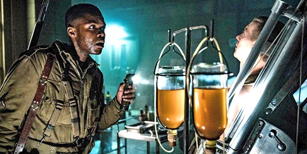 THE HORROR OF WAR Jovan Adepo stars as Boyce, a World War II-era paratrooper dropped behind enemy lines and right into a Nazi supernatural experiment, in the horror/mystery/action film Overlord. - PHOTO COURTESY OF BAD ROBOT