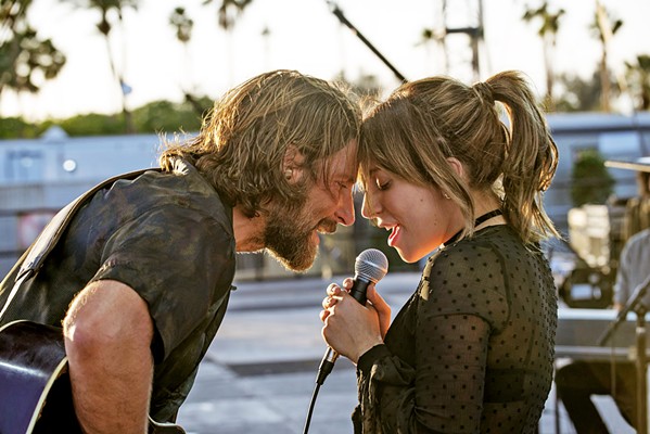 CROSSED TRAJECTORIES A seasoned performer near the end of his career (Bradley Cooper, left) discovers, nurtures, and falls in love with a talented newcomer (Lady Gaga) in A Star is Born. - PHOTO COURTESY OF WARNER BROS. PICTURES
