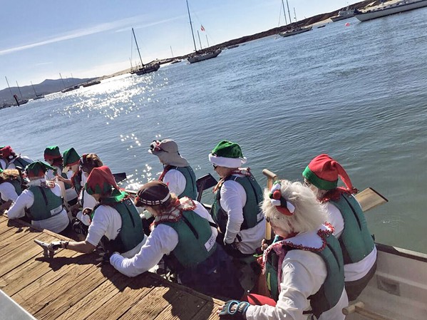 ELFING AROUND In addition to the evening grandeur of the Lighted Boat Parade, paddle boarders, kayakers, and surfers are welcome to a day parade. - PHOTO COURTESY OF TERI BAYUS