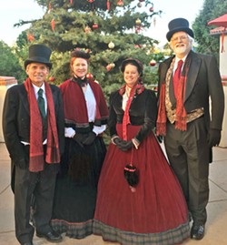 VICTORIAN MOTIF! The Uncommonne Carolers, (left to right) Craig Updegrove, Karla Santare, Meagan Glimpse, and Chuck Hiigel, perform everything from church hymns to modern popular holiday songs arranged both simply and in more complicated jazz and classical styles. - PHOTO COURTESY OF LINDA A. WILSON