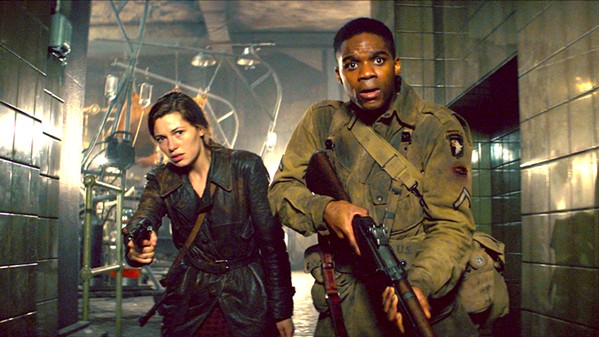 WHERE'S PAUL? French freedom fighter Chloe (Mathilde Ollivier, left) with the help of U.S. soldier Boyce (Jovan Adepo) go in search of Chloe's little brother, who's been taken to a Nazi laboratory where local villagers are being experimented on. - PHOTOS COURTESY OF BAD ROBOT