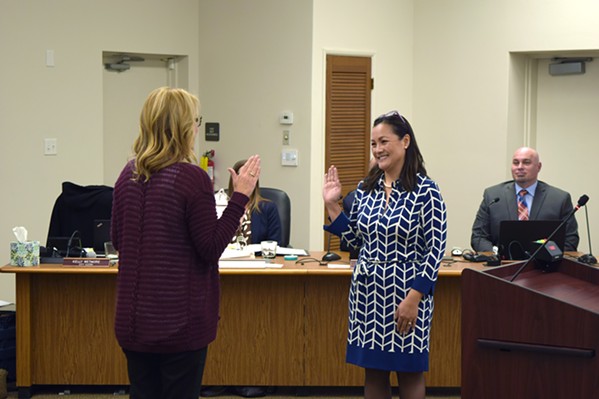 NEW FACES Lan George takes the oath of office after being appointed to fill a vacant seat on the Arroyo Grande City Council on Jan. 8. The day before, the Grover Beach City Council voted to appoint Desi Lance to its own vacant seat. - PHOTO BY AIDAN MCGLOIN