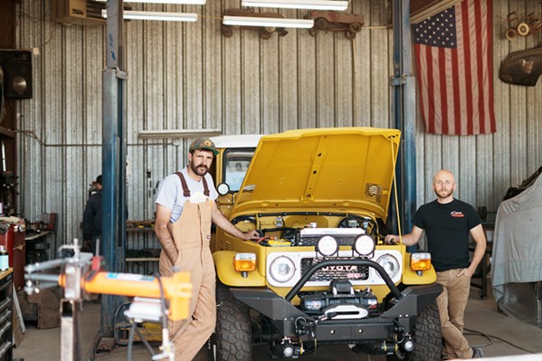 CREATED FOR CONSERVATION Nathan Stuart (left) and Steven Ploog (right) rebuilt two Toyota Landcruisers to run on biodiesel fuel. They plan to drive them through Central America in May for a film series that will document conservation projects in the region. - PHOTO COURTESY OF STEVE PLOOG
