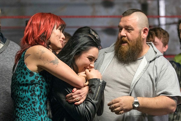 FAMILY TIES Saraya "Paige" Bevis (Florence Pugh, center) feels the love from her wrestling parents, Julia (Lena Headey) and Patrick (Nick Frost). - PHOTOS COURTESY OF METRO-GOLDWYN-MAYER