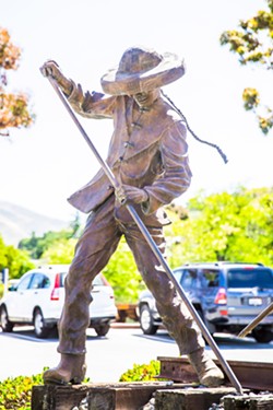 STATUE DEBATE All of SLO's existing public statues depict symbolic subjects, like this Chinese rail worker, as opposed to specific historic individuals. In July, the City Council will discuss its monument policy. - PHOTO BY JAYSON MELLOM