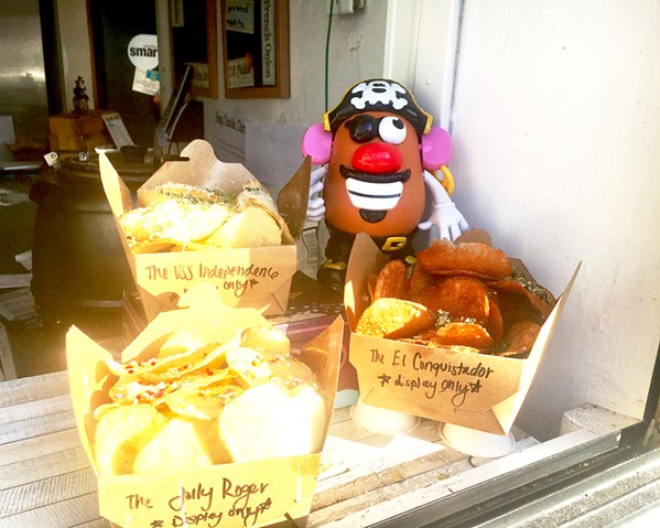 POSING POTATO HEAD Mr. Potato Head doesn't just pose with Chipwrecked's chips. He has made an appearance in many of owner Sarah Paddack's photos, including taking the forefront of several snapshots from a recent trip to Europe: "He goes everywhere with us now," Paddack said. "We just took him to the drive-in the other night." - PHOTOS BY BETH GIUFFRE