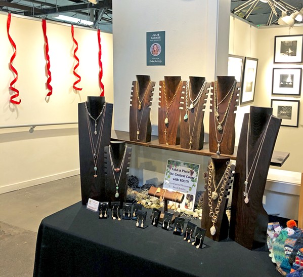 LOCAL CREATIONS Amid holiday decorations and Studios on the Park's usual fine art selection, Paso Robles local Julie Parker's handmade jewelry is for sale. - PHOTO BY MALEA MARTIN