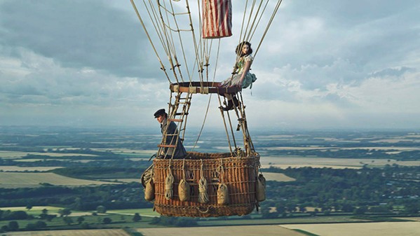 GET HIGH In 1862, Amelia Wren (Felicity Jones) and scientist James Glaisher (Eddie Redmayne) take flight in a gas balloon to attempt to fly higher than anyone in history, The Aeronauts. - PHOTO COURTESY OF AMAZON STUDIOS