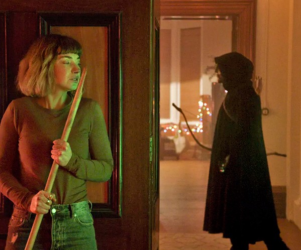 ALL THROUGH THE HOUSE Imogen Poots stars as Riley (left), a college co-ed stalked by a killer over Christmas break, in Black Christmas, screening exclusively at Park Cinemas. - PHOTO COURTESY OF UNIVERSAL PICTURES
