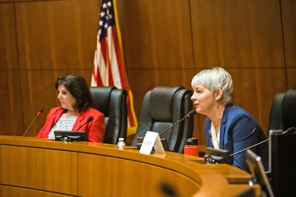 DEBATING Ellen Beraud (right) talks during an election forum against Debbie Arnold, SLO County's 5th District supervisor. - PHOTO BY JAYSON MELLOM