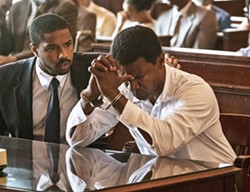 SETTING THE RECORD STRAIGHT Attorney Bryan Stevenson (Michael B. Jordan, left) faces off against a corrupt criminal justice system in his bid to have wrongly convicted murderer Walter "Johnny D" McMillian (Jamie Foxx) released from Alabama's death row, in the true story Just Mercy. - PHOTO COURTESY OF WARNER BROS. PICTURES