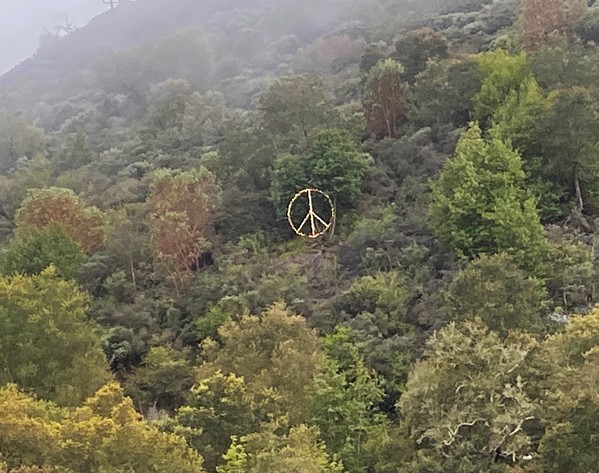 SHINING BRIGHT As they go over the Cuesta Grade, drivers on Highway 101 can see Lyle Nighswonger's peace sign made from an old satellite dish. - PHOTO COURTESY OF MARBY HAMBRIGHT