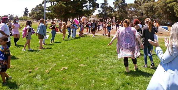 CELEBRATING PRIDE About 100 people gathered at Ryon Park in Lompoc to celebrate Pride Month and remember LGBTQ-plus community members who have been killed violently. - PHOTO BY ZAC EZZONE