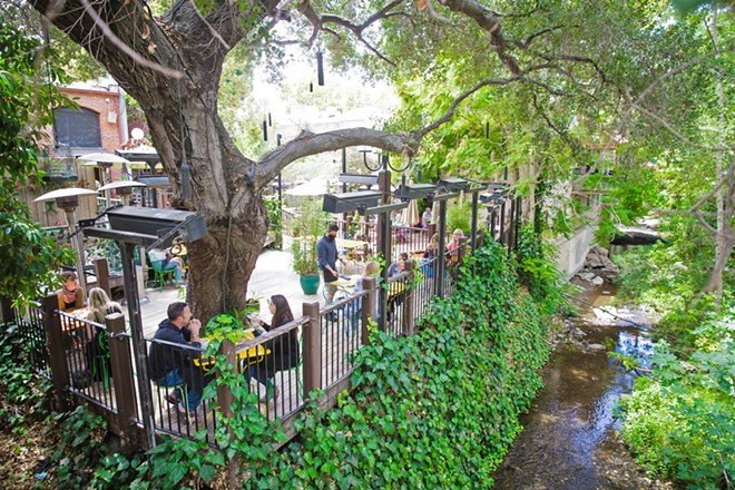 PATIO PLEASURE Although outdoor dining options in SLO are increasing with the COVID-19 pandemic, Novo Restaurant &amp; Lounge's patio puts diners right on the creek in the heart of downtown. It's the best. - PHOTO BY JAYSON MELLOM