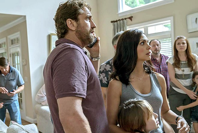 READY TO RUN! The Garritys&mdash;(center) John (Gerard Butler), Allison (Morena Baccarin), and their young son Nathan (Roger Dale Floyd)&mdash;learn they've been chosen to join a group of selected survivors being transported to underground bunkers, in Greenland, available at Redbox.