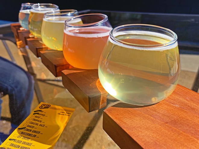 CATCH A FLIGHT SLO Cider Co. has several different apple ciders on tap, including (front to back) pineapple, blood orange, lemon ginger, hopped, and dry.