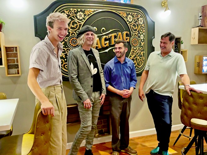 INVITING VIBE From left, servers Luke O'Leary, Ryan Moreira, and Thomas Grandoli, and tasting room manager Patrick McTiernan greet customers at Ragtag's recently opened tasting room in downtown San Luis Obispo.