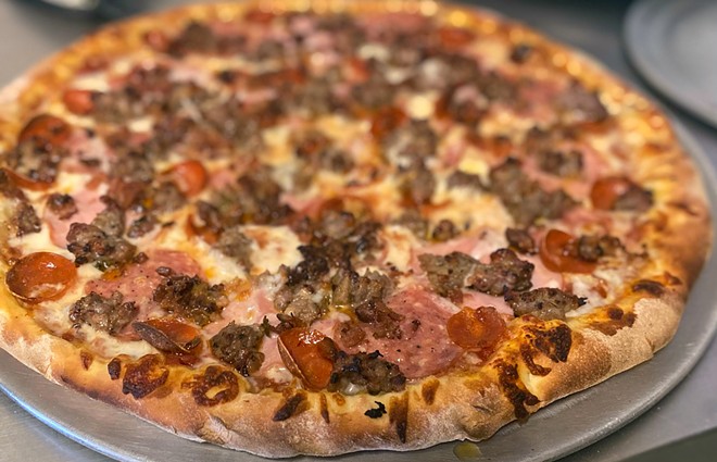 FAN FAVORITE Ocean Front's Meat Lovers pizza is stacked with salami, pepperoni, sausage, and Canadian bacon, plus freshly shredded cheese and house marinara.