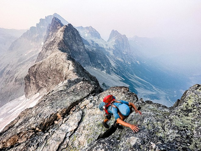 HANG ON Andrew Okerlund scrambles up East Mox, one of the peaks on The Bulger List.