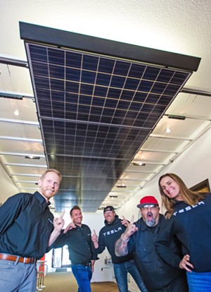 DOUBLE TAKE Yes, everyone, TESLA is now in the SolarCity business. From left to right: Tyson Maulhardt, Chris Bechtel, William Townsley, Dog, and Gina Armstrong are all pretty happy to work at the best solar company in the county. - PHOTO BY JAYSON MELLOM