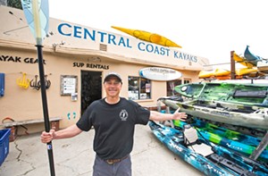 PEOPLE POWER Central Coast Kayaks co-owner Tom Reilly knows that some of the coolest places on the coastline are only accessible by kayak or paddleboard. Maybe that’s why he’s co-running the best water sports company in the county! - PHOTO BY JAYSON MELLOM