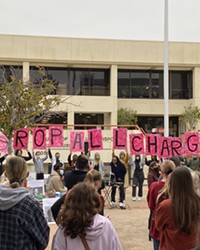 'DROP ALL CHARGES' Hundreds gathered in front of the San Luis Obispo County Courthouse on Oct. 22 to support local activists Tianna Arata, Marcus Montgomery, Amman Asfaw, and Joshua Powell.