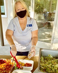 CHIPPING IN El Camino Homeless Organization (ECHO) volunteer Wendy Johnson serves dinner to clients in Atascadero on Jan. 7. ECHO is looking for more community volunteers to help with its expansion to Paso Robles.