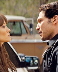 FIRED UP Former smokejumper Hannah Faber (Angelina Jolie) argues with her ex, Deputy Sheriff Ethan Sawyer (Jon Bernthal), in Those Who Wish Me Dead, screening at most local theaters and on HBO Max.