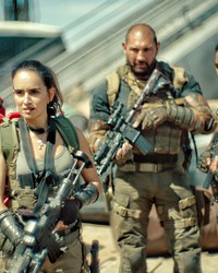 ZOMBIE FOOD A team of mercenaries infiltrates a walled-off Las Vegas infested with zombies in a bid to steal $200 million from a casino's underground vault, in Army of the Dead, screening on Netflix.