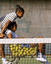 CHAMPION MAKER Richard Williams (Will Smith) makes tennis superstars of his daughters Venus (Saniyya Sidney) and Serena (Demi Singleton), in King Richard, screening in local theaters and HBO Max.