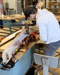 MASTER CONSTRUCTOR Adam Harris constructs his award-winning lamp called Wish, which he made using steam-bending techniques.