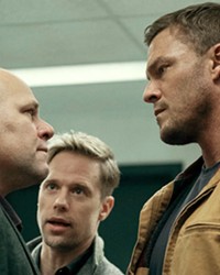 TESTOSTERONE TANGO (Left to right) Cop Gaitano "Guy" Russo (Domenick Lombardozzi), David O'Donnell (Shaun Sipos), and Jack Reacher (Alan Ritchson) are thrown into an international arms dealing conspiracy in Reacher, season 2, streaming on Amazon Prime.