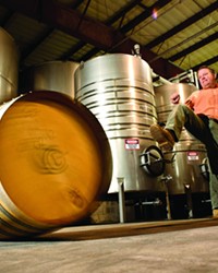 KICKIN&rsquo; IT :  Mike Sinor, one of many winemakers participating in the annual Roll Out the Barrels celebration, showcased his barrel rolling skills for New Times.