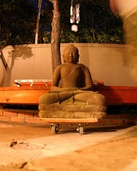 GHOST OF ZEN :  Michael Brevetz walked by a statue in the garden at Tridosha in the weeks before the healing center opened in 2006.