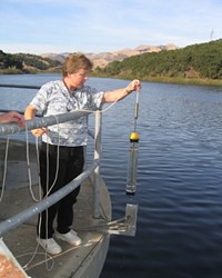 TESTING THE WATERS :  Lopez Lake water spends 30 days in the terminal reservoir off Orcutt Road, where Water Systems Chemist Lisa Wallender grabs samples at various depths.