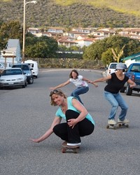 ROLLIN WITH THE SISTERS :  Surf Sisters (left to right) Jennifer Jozwiak, Deby Hansen (crouching), Christy Serpa (background), Colleen Gnos, and Jennifer Blonder want to show you movies for the good of the ocean.