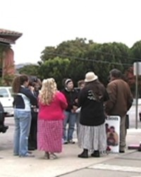 TWO GROUPS :  Demonstrators regularly gather outside of San Luis Obispos Planned Parenthood office, which prompts volunteers (such as the one in the black vest at left) to escort women seeking abortions in and out of the building.