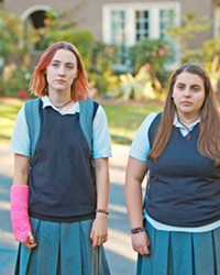 DREAMERS Besties Lady Bird (Saoirse Ronan, left) and Julie (Beanie Feldstein) dream of living in some of the fancy houses they see on their walk home from school.