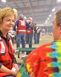 LENDING AN EAR Longtime Red Cross volunteer Carolyn Pandol listens to shelter resident Michelle Mullin tell the story of how she escaped from the Thomas Fire.