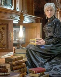 ECCENTRIC OR CURSED? Sarah Winchester (Helen Mirren) believes she's been cursed and is haunted by the ghosts of those killed by the rifle that bears her name.