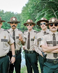 IDIOTS Vermont Troopers&mdash;(left to right) Rodney Farva (Kevin Heffernan), Arcot 'Thorny' Ramathorn (Jay Chandrasekhar), Robert 'Rabbit' Roto (Erik Stolhanske), Carl Foster (Paul Soter), MacIntyre 'Mac' Womack (Steve Lemme)&mdash;open an office in a disputed border town between Canada and the U.S.