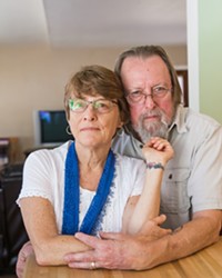 PAYING TRIBUTE Kim Lacey, of Atascadero, with her husband, Dan Grahm, in their home, shows her tattoo that she got in memory of her son Ty after he overdosed on heroin in 2016.
