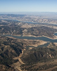 LAKE FIGHT A group representing Lake Nacimiento property owners has hired an attorney to explore a legal solution to a dispute with Monterey County Water Resources Agency over the amount of water released via the reservoir dam.