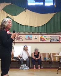 WILL THE REAL PROGRESSIVE PLEASE STAND UP? SLO Mayor Heidi Harmon (right) addresses the SLO County Progressives Democratic Club on July 26, as her election challenger, T. Keith Gurnee (left), watches. The club overwhelmingly endorsed Harmon for mayor, but not before Harmon cut the forum short.