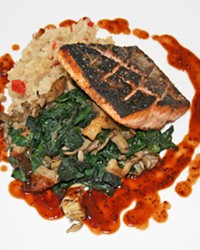 LABOR OF LOVE A portion of wild mushroom rainbow chard offers a tender, earthy bite in contrast with flavorful seared Pacific salmon topped with syrah barbecue sauce.