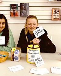 SPREADING KINDNESS SLO High School REACH Club members Malia Cari&ntilde;o (left) and Sabrina Marks (right) hold up "kindness cards," which were individually crafted and distributed to 700 peers, staff, and teachers last March.