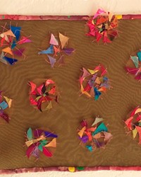 LEFTOVER Instead of buying new supplies, fiber artist Kate Froman is trying to use all of her leftover fabric scraps to make pieces like A Rare Desert Bloom.