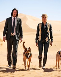 REDEMPTION BOUND Assassin John Wick finds himself on the run with a $14 million bounty on his head, reluctantly helped by another dog-loving assassin, Sofia (Halle Berry), and her two badass Belgian Malinois dogs.